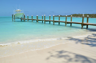 Yacht at the wooden jetty. Exuma, Bahamas