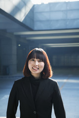 Portrait of businesswoman outdoors in a parking garage