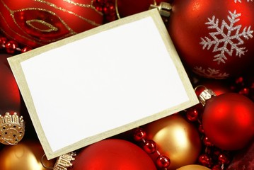 Christmas ornaments and blank white card background.