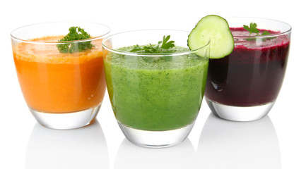Fresh vegetable juices isolated on white