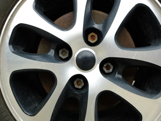 Magnesium alloy wheel with rusty bolt