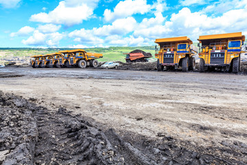big truck in open pit and blue sky