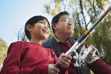 Grandfather and grandson fishing portrait