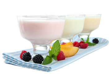Delicious yogurt with fruit and  berries isolated on white