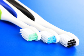 Tooth-brushes on blue background