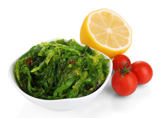 Sea kale in bowl close-up isolated on white