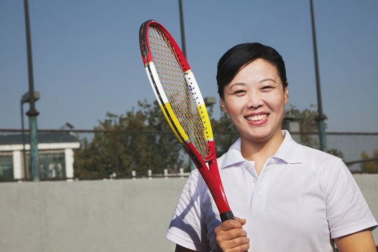 Mature Woman Playing Tennis, Portrait