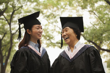 Professor and Graduate Walking On Campus