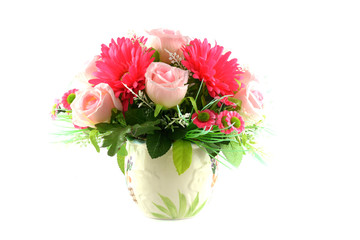 Multicolored flowers in a vase, isolated on white background