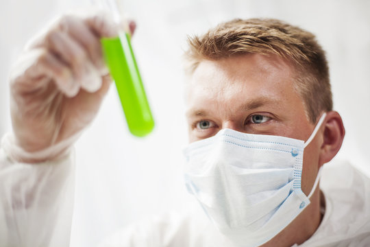 Chemist examining results of final experiment