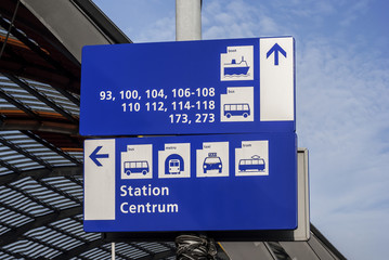 Direction to bus, taxi, tram, metro and boat signs in Amsterdam