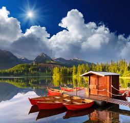 Red boat in a mountain lake