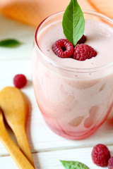 raspberry smoothie milk in a transparent glass