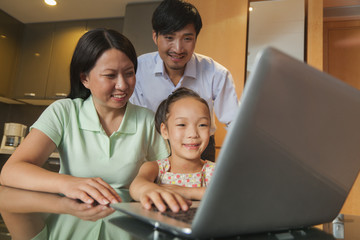 Fototapeta premium Family watching movie on the laptop 