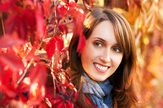 Portrait of Woman on Red Autumn Background