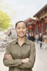 Fototapeta premium Young Woman smiling and looking at camera