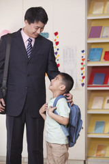 Father And Son In School Classroom