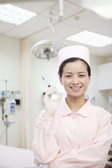 Portrait of Nurse Holding A Syringe, China