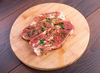 Raw steak with spices
