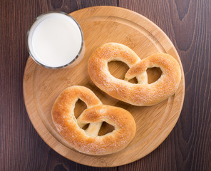 Homemade warm soft pretzels and glass of milk