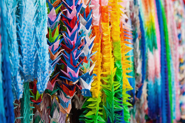 Close up of colorful origami offerings