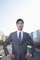 Young Businessman  Looking at Camera