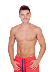 Fototapeta premium Handsome lifeguard with red swimsuit