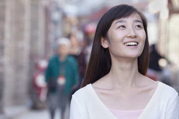 Fototapeta premium Portrait of Young Woman Outdoors in Beijing