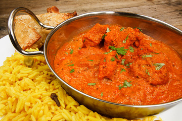 Chicken tikka masala in balti dish with rice