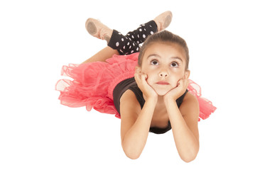 young girl happy in pink tutu black leotard laying down