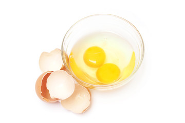 Broken egg in bowl on white background