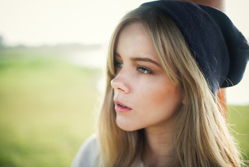 beautiful girl in a cap hipster