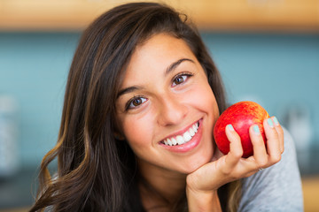 Beautiful woman with an apple