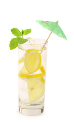 Glass of lemonade with lemon and mint.