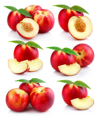 Set of ripe peach fruits with green leaves isolated