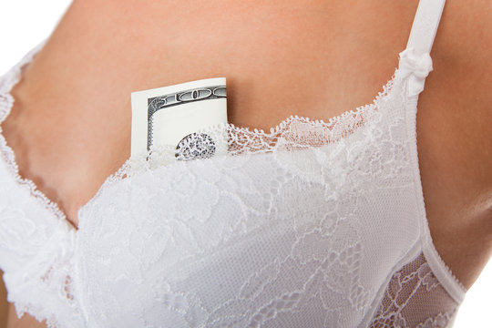 Woman with cash in bra