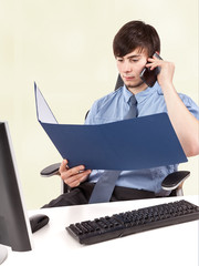 Young businessman examining contract 