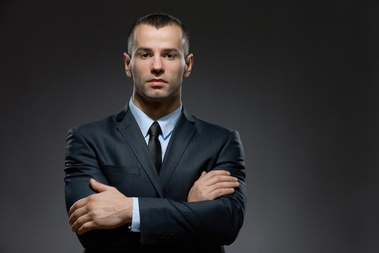 Half-length portrait of man wearing business suit