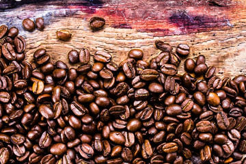 Coffee beans on grunge old wooden background. Coffee concept. To