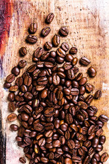 Coffee beans on grunge old wooden background. Coffee concept. To