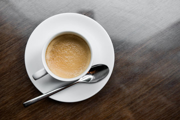 Cup of coffee on a wooden table