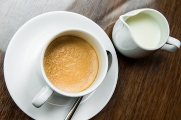 Cup of coffee on a wooden table