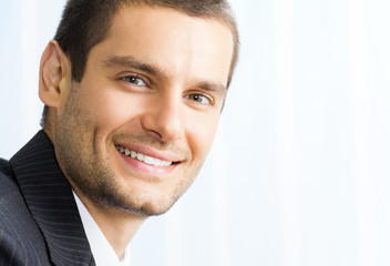 Happy smiling young businessman