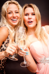 two women drinking champagne