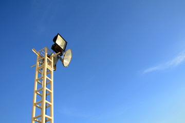 The stadium light on blue sky background.