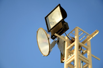 The stadium light on blue sky background.