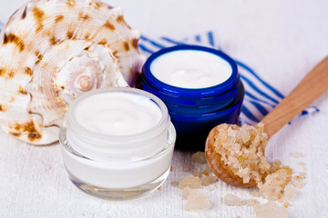 face cream in jars with sea salt and shell