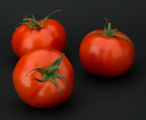 Tomato vegetables isolated on black background