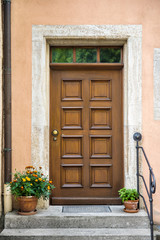 Fototapeta na wymiar Front door with decorative flowers