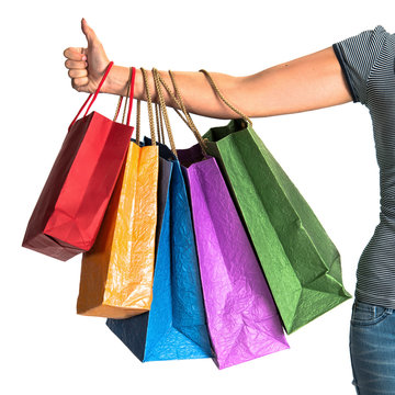 Woman's hand holding shopping bags